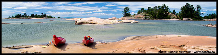 Kayaks on the pink granite shorelines of Phillip Edward Island Killarney Ontario ,Bonnie McIntyre www.bonsta.ca 1 226 228 3755
